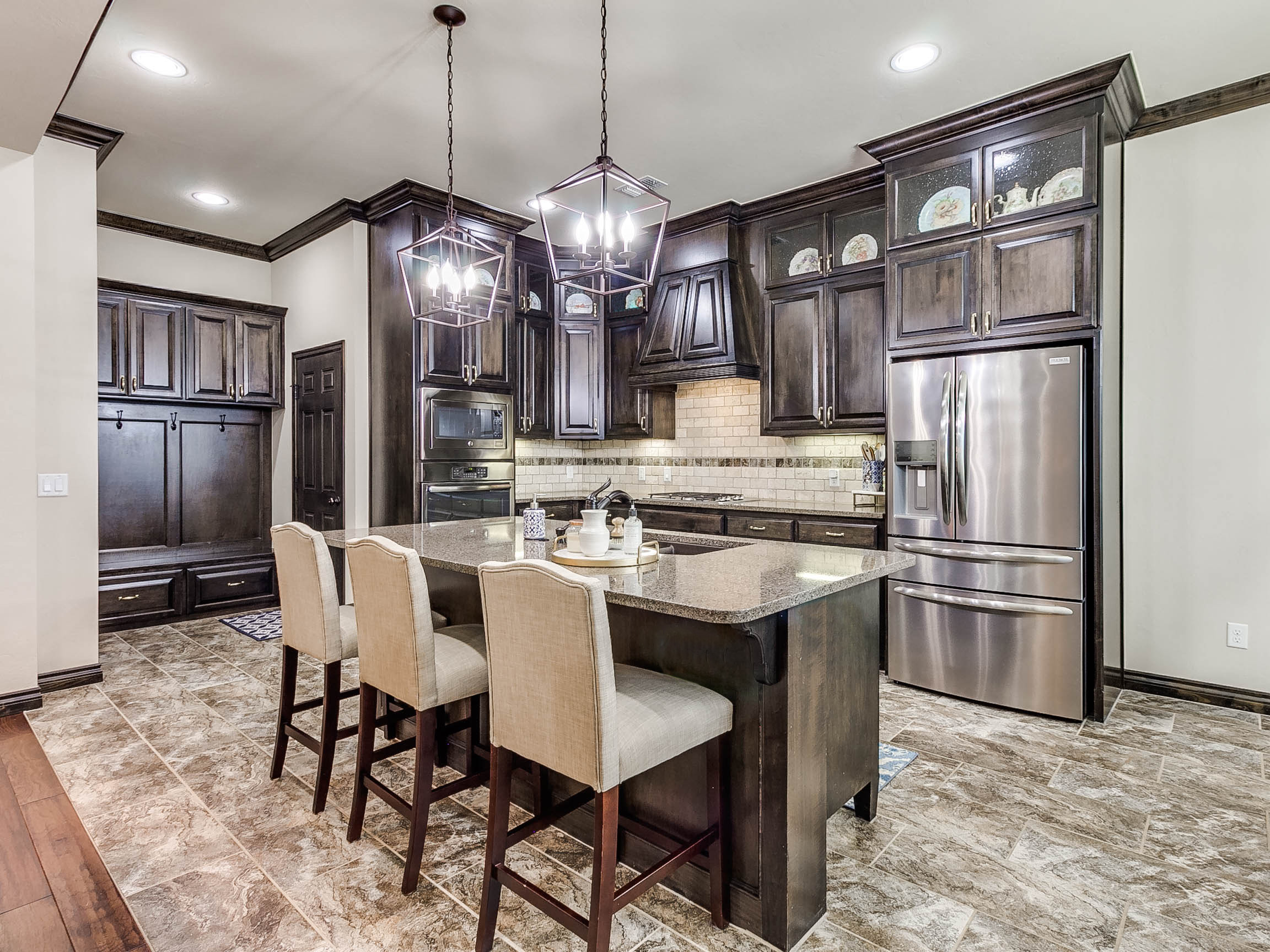 Staged kitchen with dark cabinetry